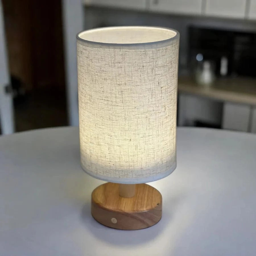 Lavisa Cordless Scandinavian Table Lamp with wooden base on a minimalist desk (View 4)