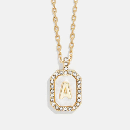 Lavisa Gold and Mother of Pearl Initial Necklace featuring a custom letter on a dog tag pendant