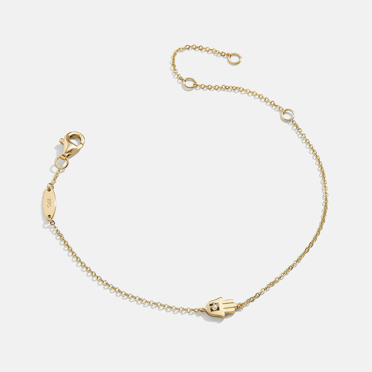 Lavisa 18K Gold Hamsa Protection Bracelet with a petite hamsa pendant and cubic zirconia.