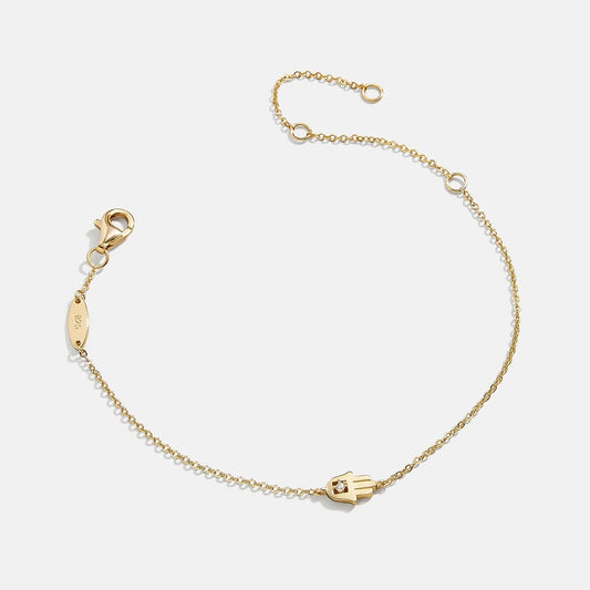 Lavisa 18K Gold Hamsa Protection Bracelet with a petite hamsa pendant and cubic zirconia.