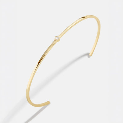 Lavisa 18K gold cuff bracelet with center stone on a clean background