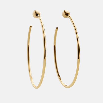 Lavisa Dalilah thin gold hoop earrings displayed on a neutral background