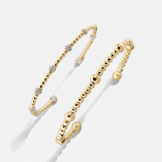 Lavisa gold and crystal cuff bracelet set displayed on a neutral background