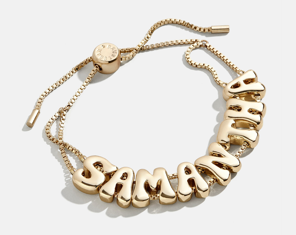 Lavisa custom gold bubble letter slider bracelet on double-strand chain