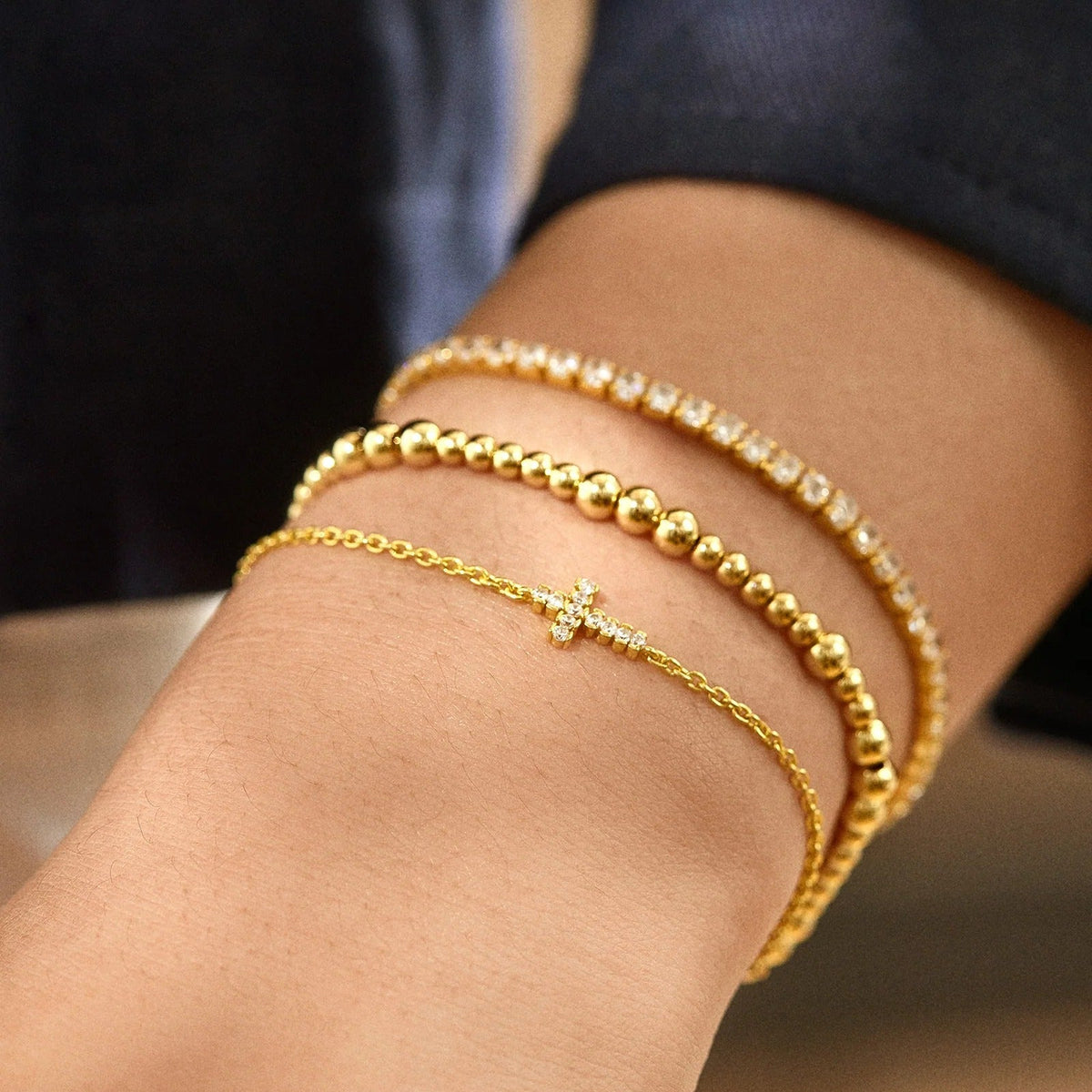 Lavisa - 18K Gold Cross Charm Bracelet With Cubic Zirconia - Detail & Styling View