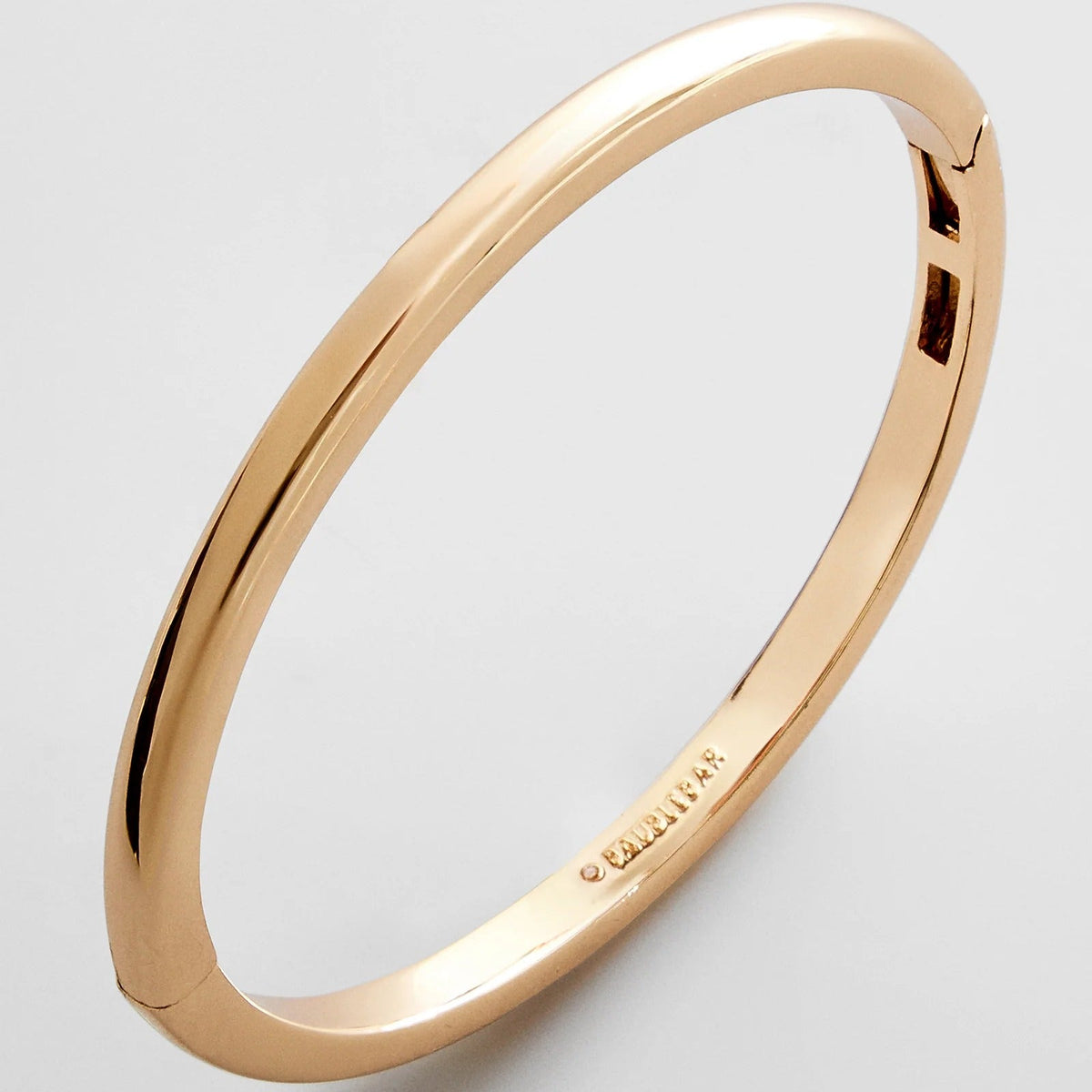 Lavisa Classic Hinge Bangle in polished gold and silver showcasing its sleek design