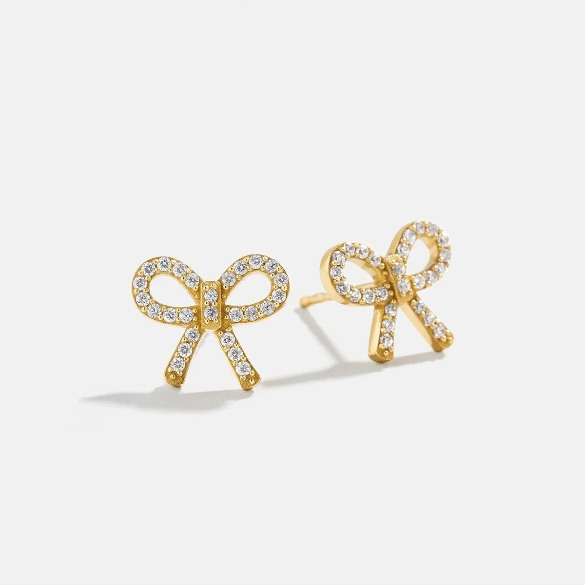 Lavisa Pavé Bow Earring Studs in gold with sparkling cubic zirconia stones