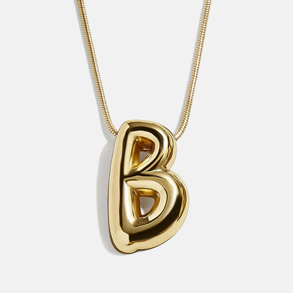 Lavisa Bubble Initial Necklace showing a dimensional letter pendant on a snake chain