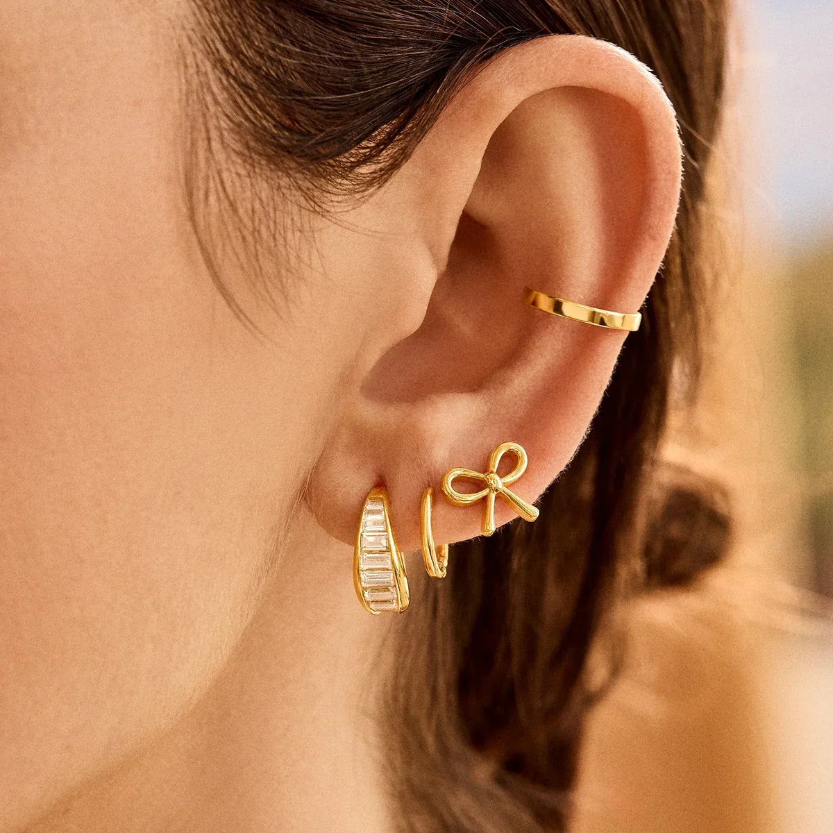 Lavisa - Delicate Bow Gold Stud Earrings - Detail & Styling View