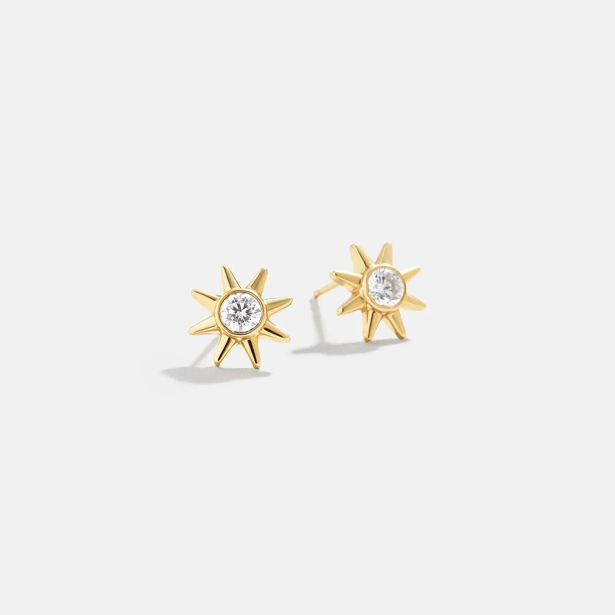 Lavisa 18K gold celestial sun delicate stud earrings on display