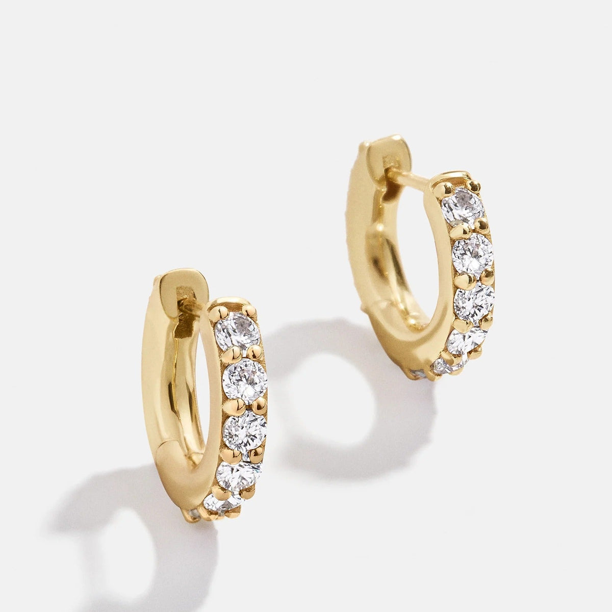 Lavisa 14K gold birthstone crystal huggie earrings with brilliant cubic zirconia stones
