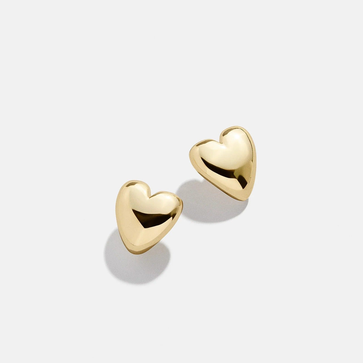 Lavisa Gold Heart Huggie Hoop Earrings in a polished finish