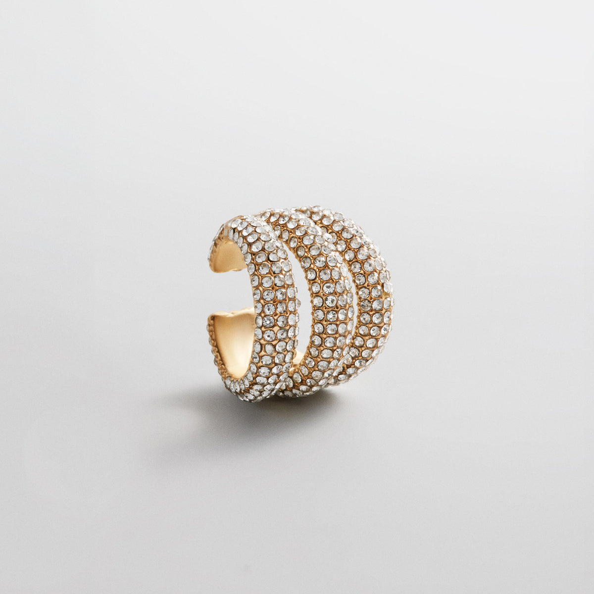 Lavisa gold statement ear cuff with crystal pave detailing for layered ear stacks