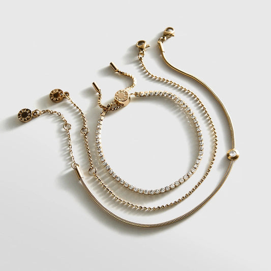 Lavisa Waterproof Pavé Bracelet Set featuring three stainless steel gold bracelets designed for active wear.