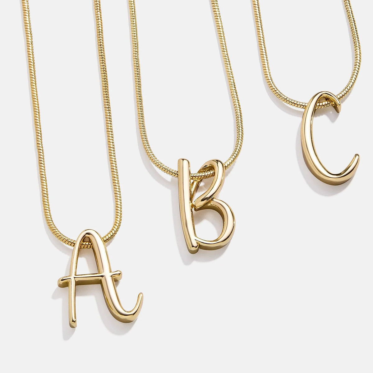Lavisa Classic Script Initial Necklace featuring a swirly font letter pendant on a dainty chain