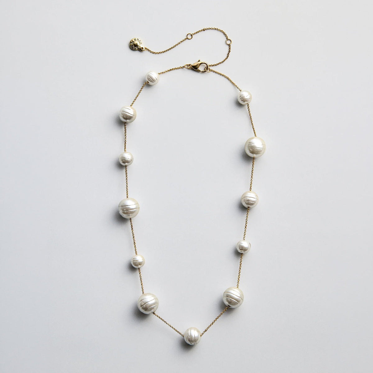 Lavisa chic pearl statement necklace with multi-sized pearls on a gold chain