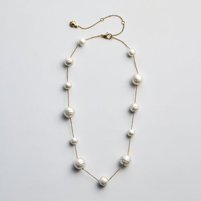 Lavisa chic pearl statement necklace with multi-sized pearls on a gold chain