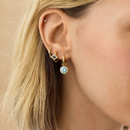 Lavisa - 18K Gold Evil Eye Huggie Hoop Earrings - Detail & Styling View