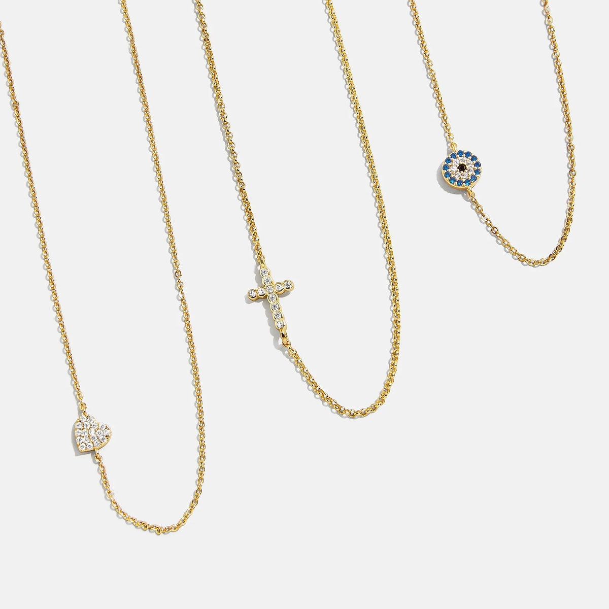 Lavisa 18K Gold Asymmetrical Cross Necklace with a sparkling cubic zirconia pendant