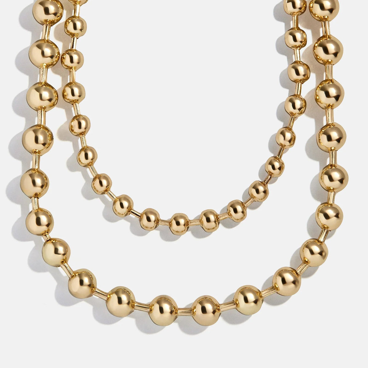 Lavisa Pisa layered gold necklace featuring glossy pisa beads.