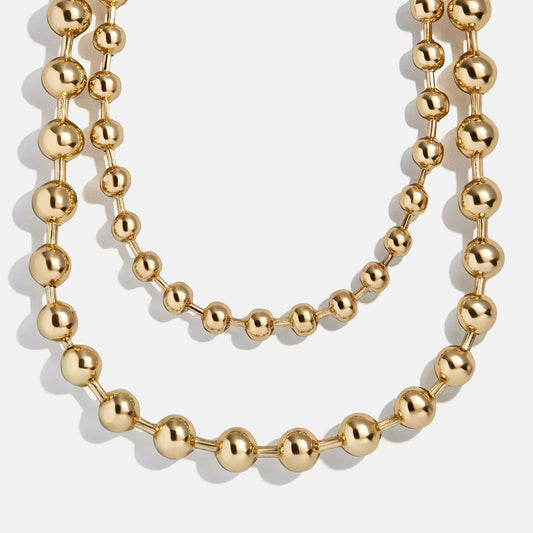 Lavisa Pisa layered gold necklace featuring glossy pisa beads.