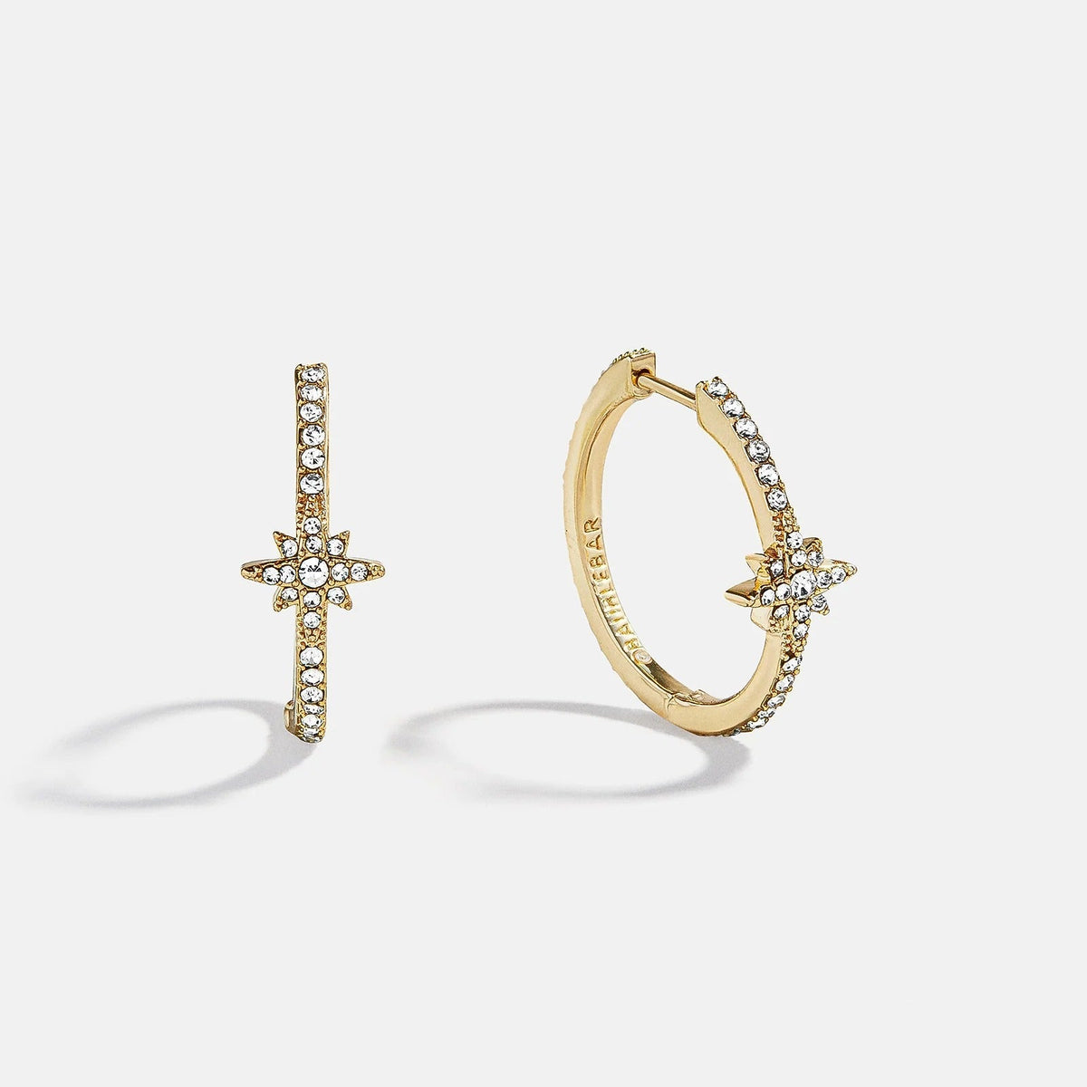 Lavisa celestial gold hoop earrings featuring a sparkling star charm with pavé stones