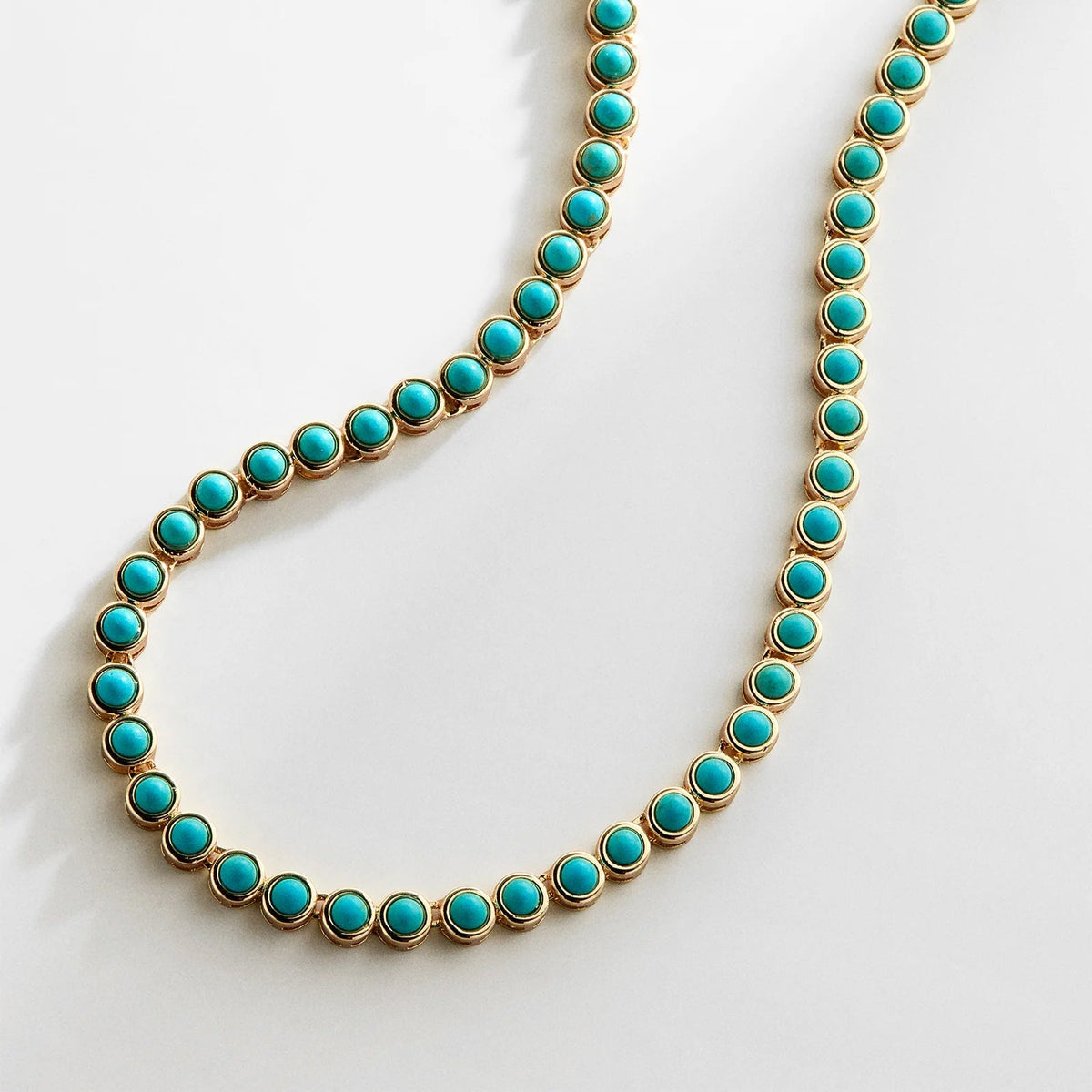 Lavisa semi-precious turquoise tennis necklace in a gold bezel setting