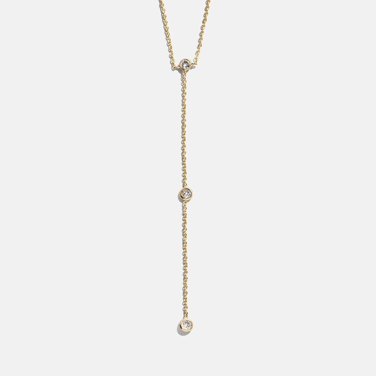 Lavisa Gold Lariat Necklace featuring delicate crystals on a dainty gold chain