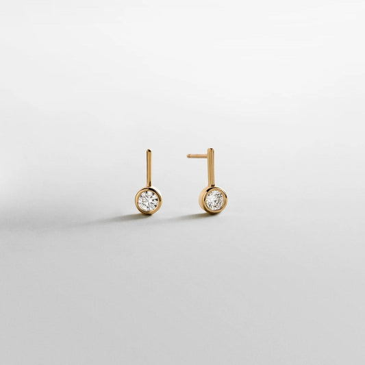 Lavisa Fallon 14K gold bezel huggie earrings with round crystal stone