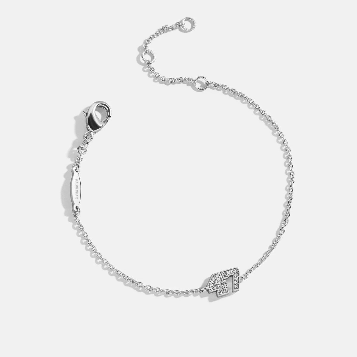 Lavisa Custom Varsity Number Station Bracelet with sparkling pavé numbers on a silver chain.