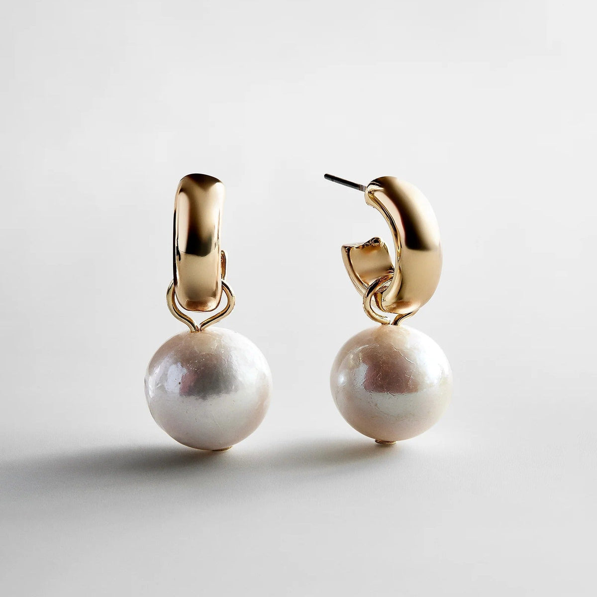 Lavisa classic pearl huggie earrings with gold finish