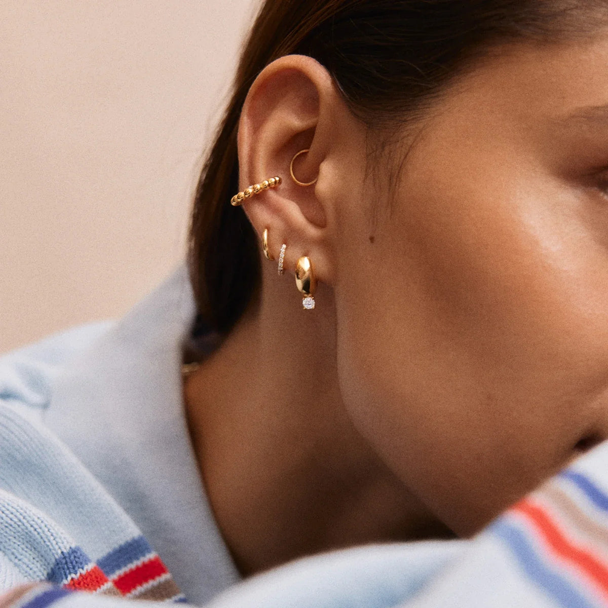 Lavisa - Glossy Gold Huggie Earrings - Detail & Styling View