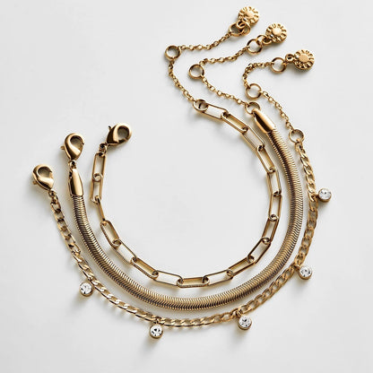 Lavisa waterproof stacking bracelet set featuring gold chains and stone details