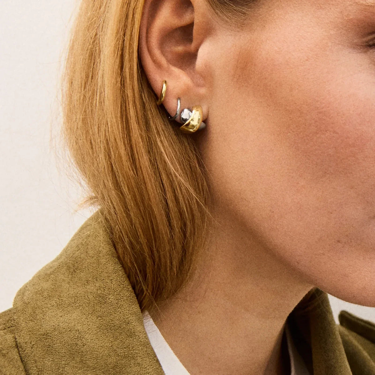 Lavisa - Crisscross Mixed Metal Stud Earrings Modern Jewelry - Detail & Styling View