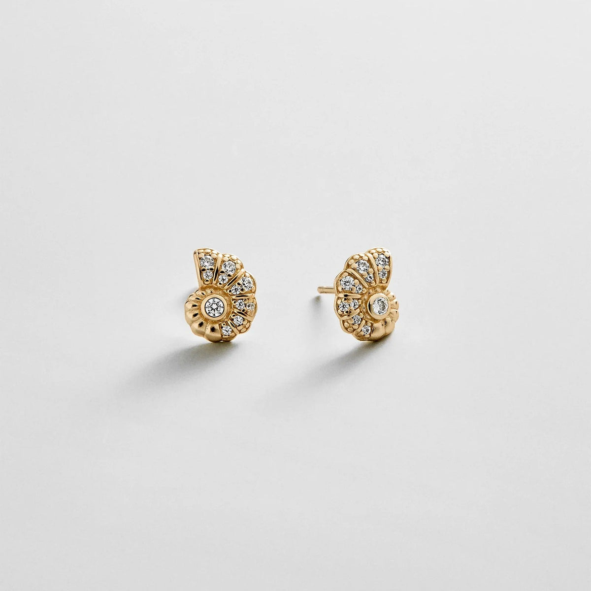 Lavisa 14K gold spiral seashell stud earrings with pavé cubic zirconia stones