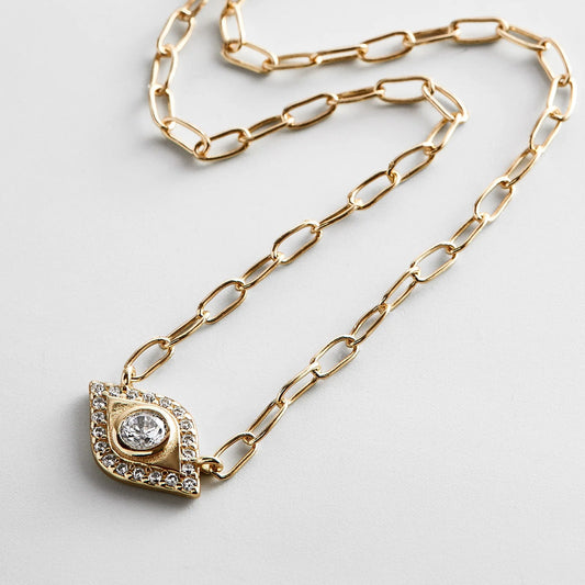 Lavisa 14K Gold Evil Eye Charm Necklace featuring a delicate protective pendant with pavé stones.