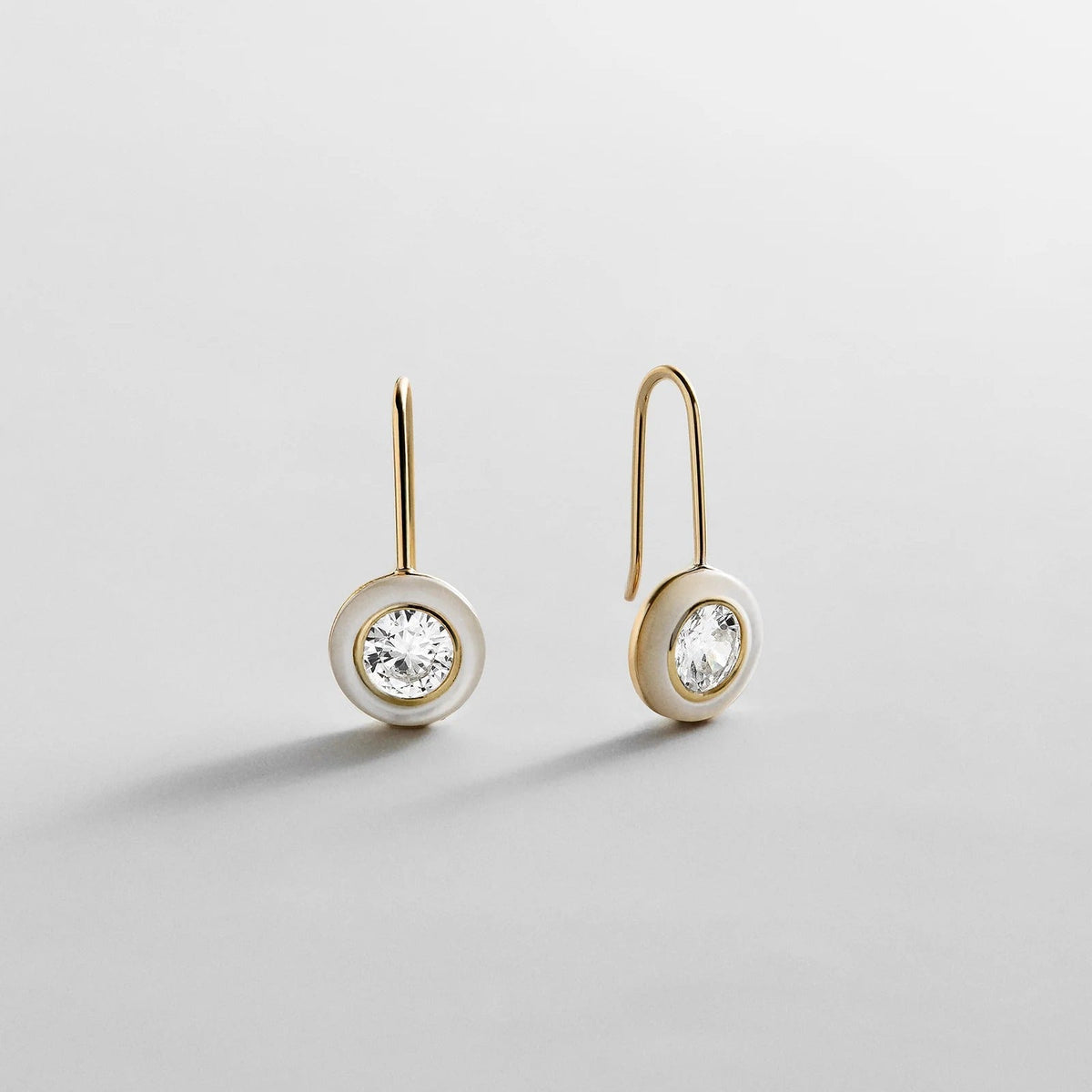 Lavisa Fallon 14k gold plated drop earrings with white quartz border