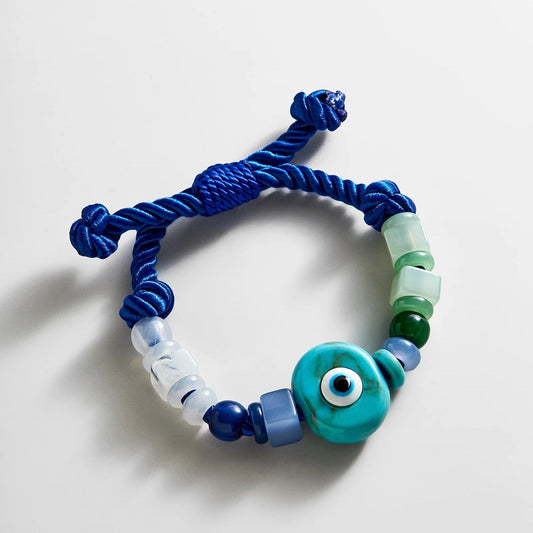 Lavisa evil eye beaded statement bracelet with turquoise charm and blue resin beads