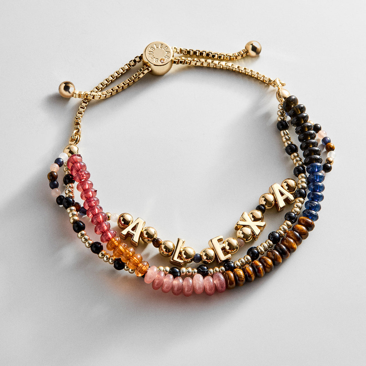 Lavisa Custom Layered Bracelet with semi-precious stones and gold personalized letter beads on white background