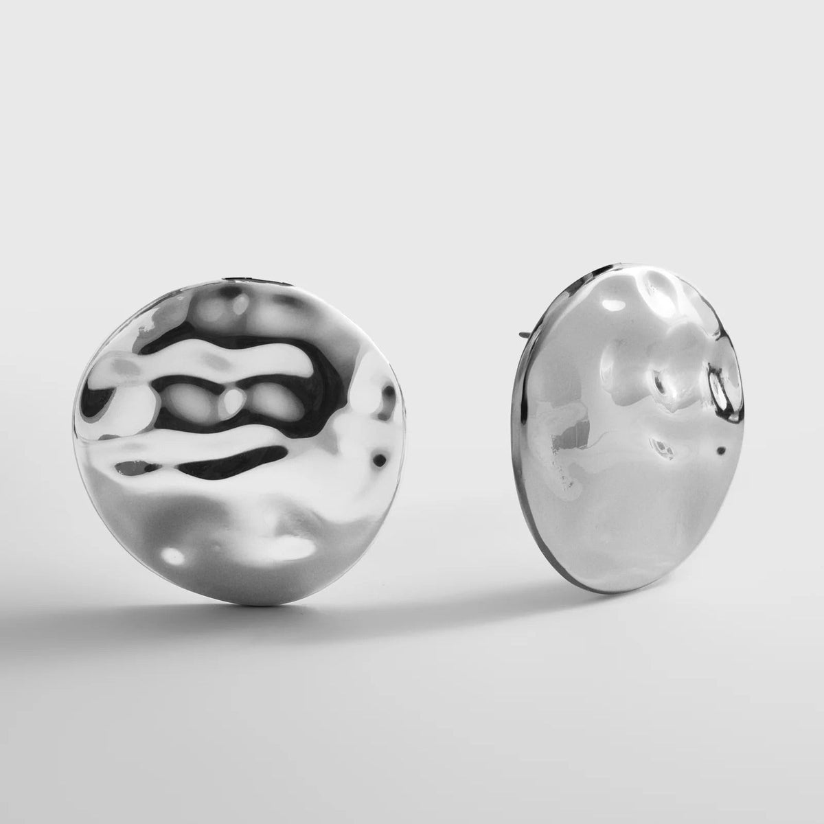 Lavisa hammered silver statement stud earrings with chunky disc texture