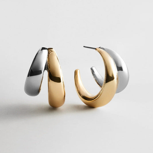 Lavisa mixed metal hoop earrings in half gold and half silver tones.