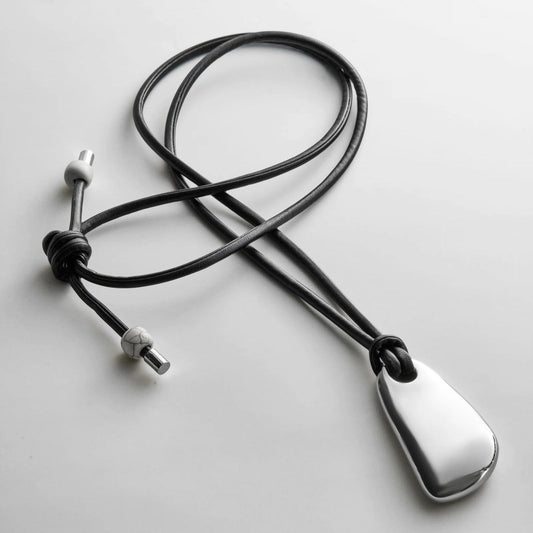 Lavisa sculptural silver pendant on an adjustable black cord necklace