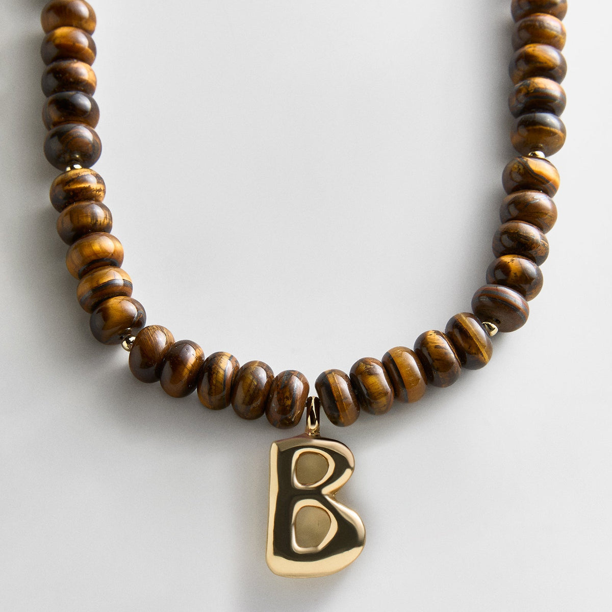 Lavisa - Initial Bubble Letter Necklace - Tiger's Eye Gemstone Jewelry - Detail & Styling View