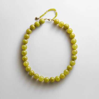 Lavisa lightweight beaded layering necklace in vibrant olive shade.