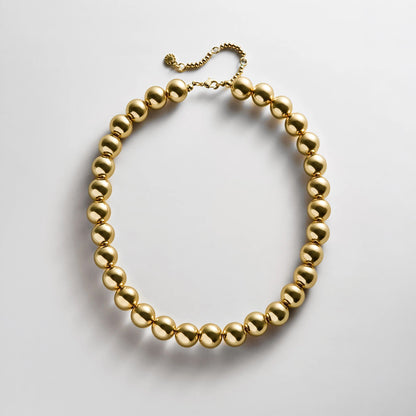 Lavisa gold beaded necklace featuring glossy 14mm resin beads for layering