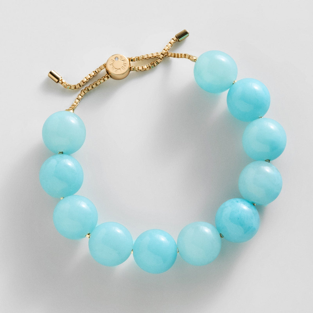 Lavisa adjustable aqua beaded bracelet with gold chain and resin beads