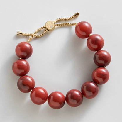 Lavisa cherry red beaded bracelet on a gold box chain with pull-tie closure