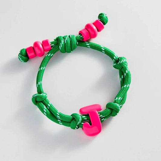 Lavisa custom initial enamel bracelet featuring colorful bubble letters on a waterproof cord