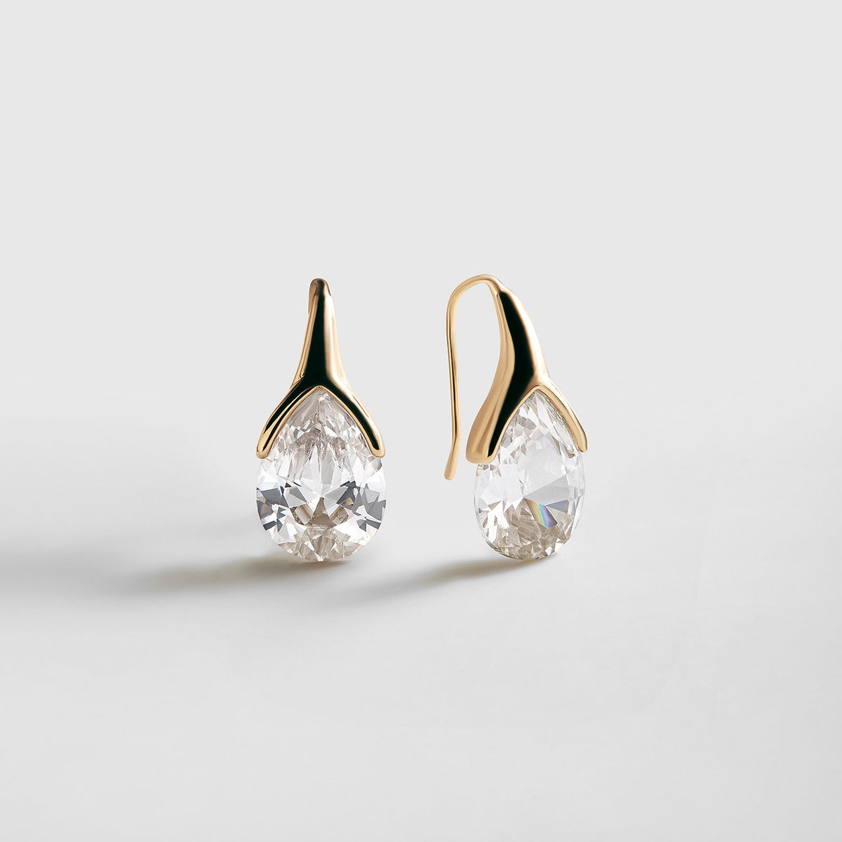 Lavisa gold crystal drop earrings with a brilliant cubic zirconia stone.
