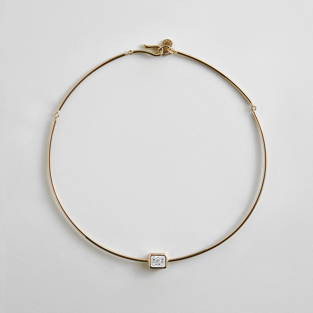 Lavisa Cubic Zirconia Collar Necklace featuring a rectangle-cut crystal and gold wire structure